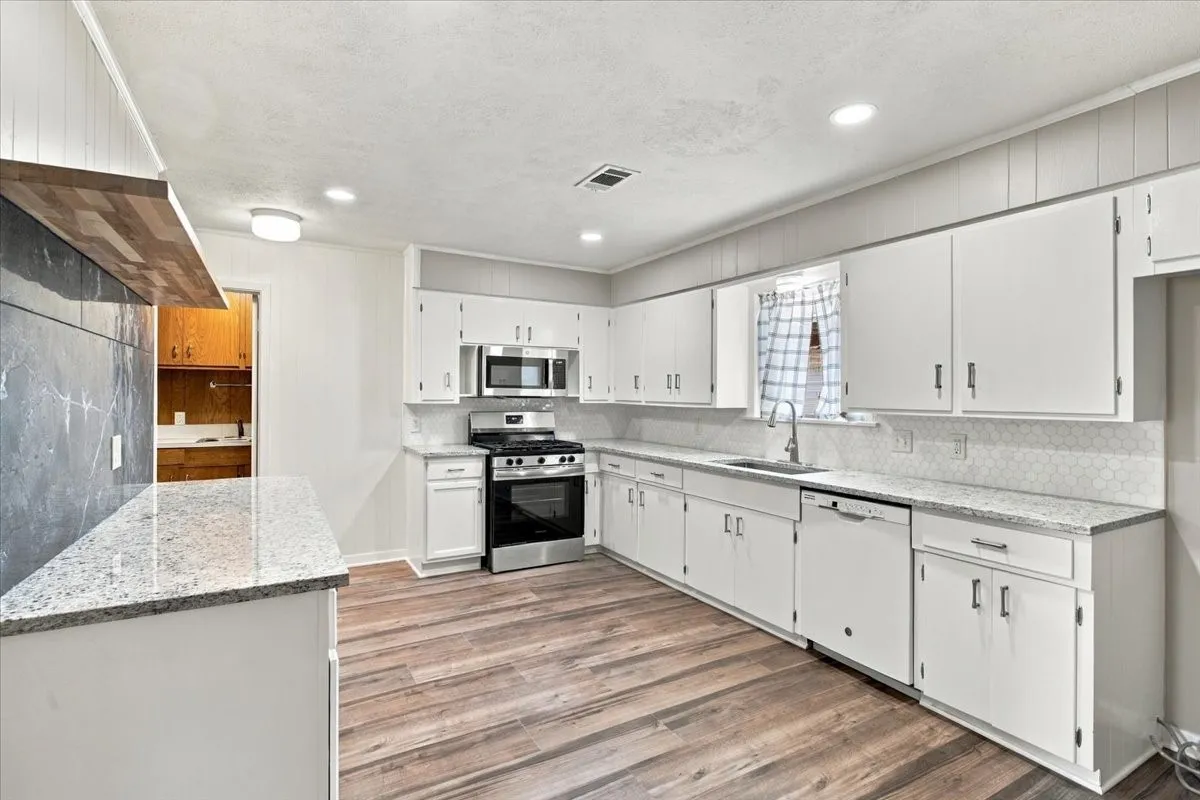 Awesome kitchen!!! Farm sink has window above for outside views of private, fenced lovely back yard.