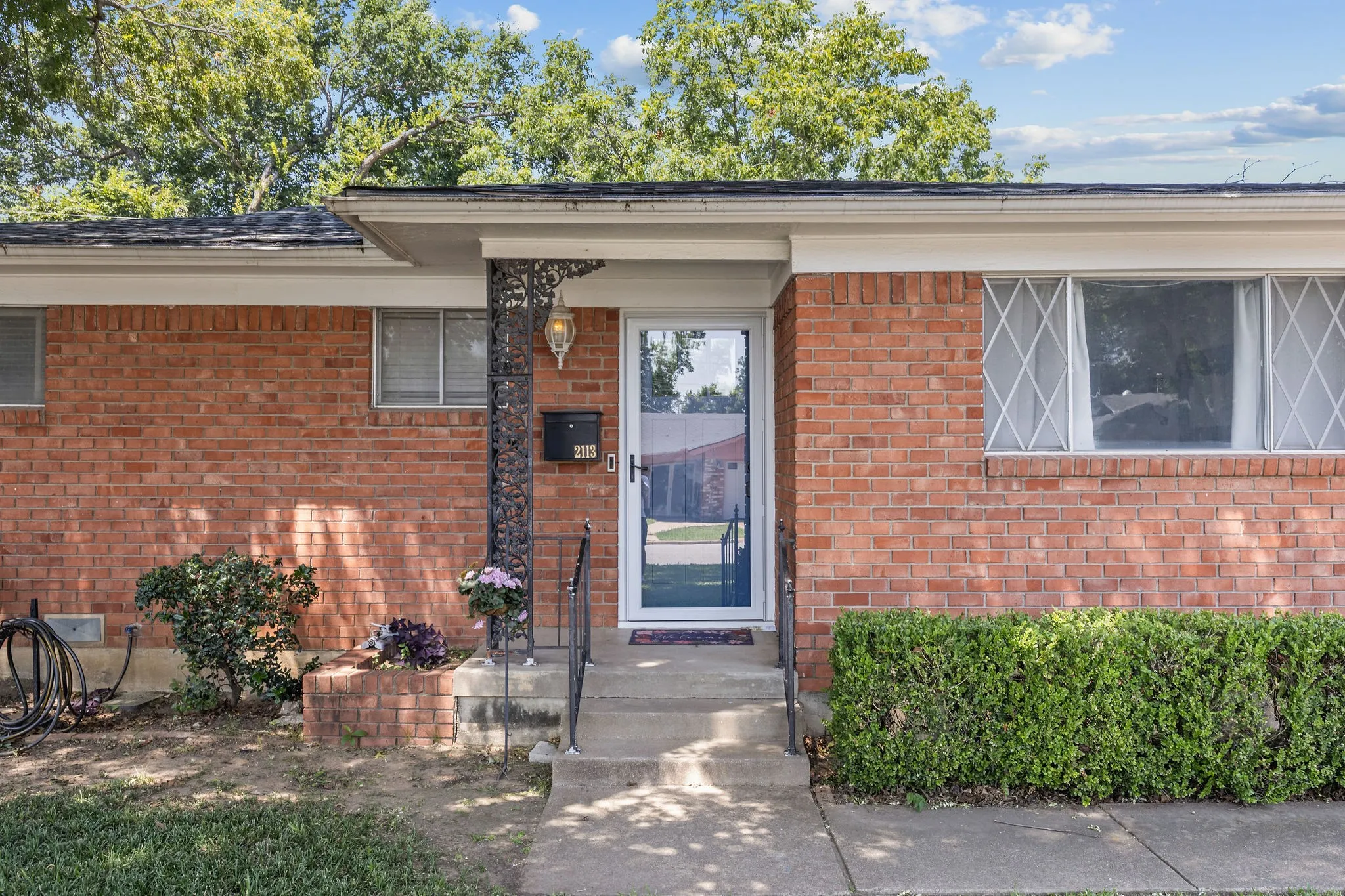 Red brick facade with white trim