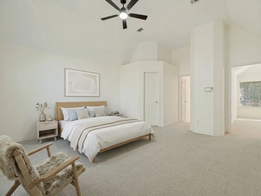 Primary bedroom with virtually staged furniture.