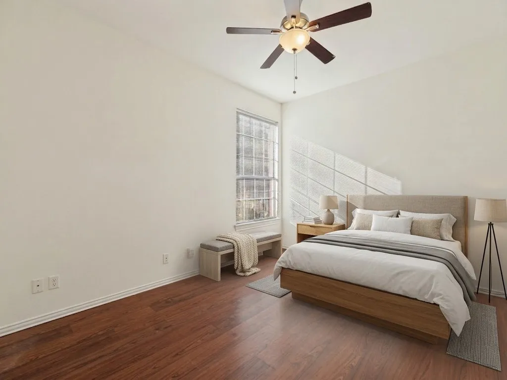Bedroom 2 with virtually staged furniture.
