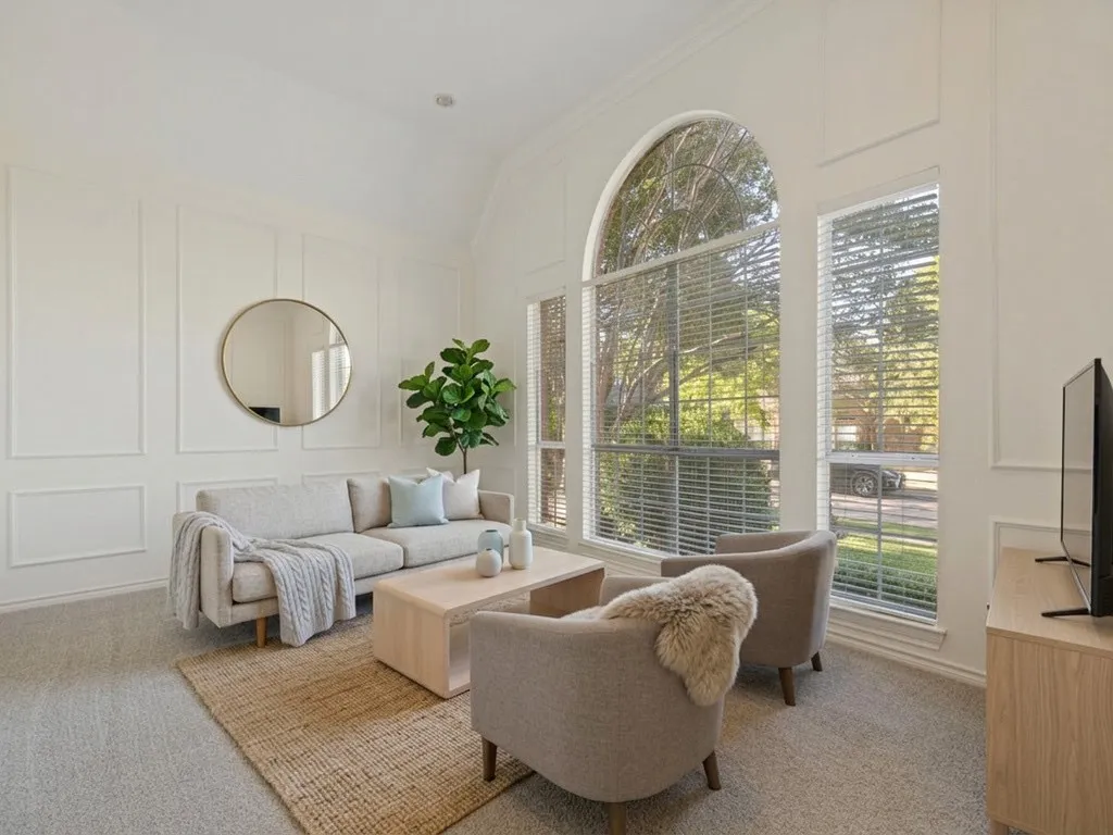 Front Living room or Office with virtually staged furniture.
