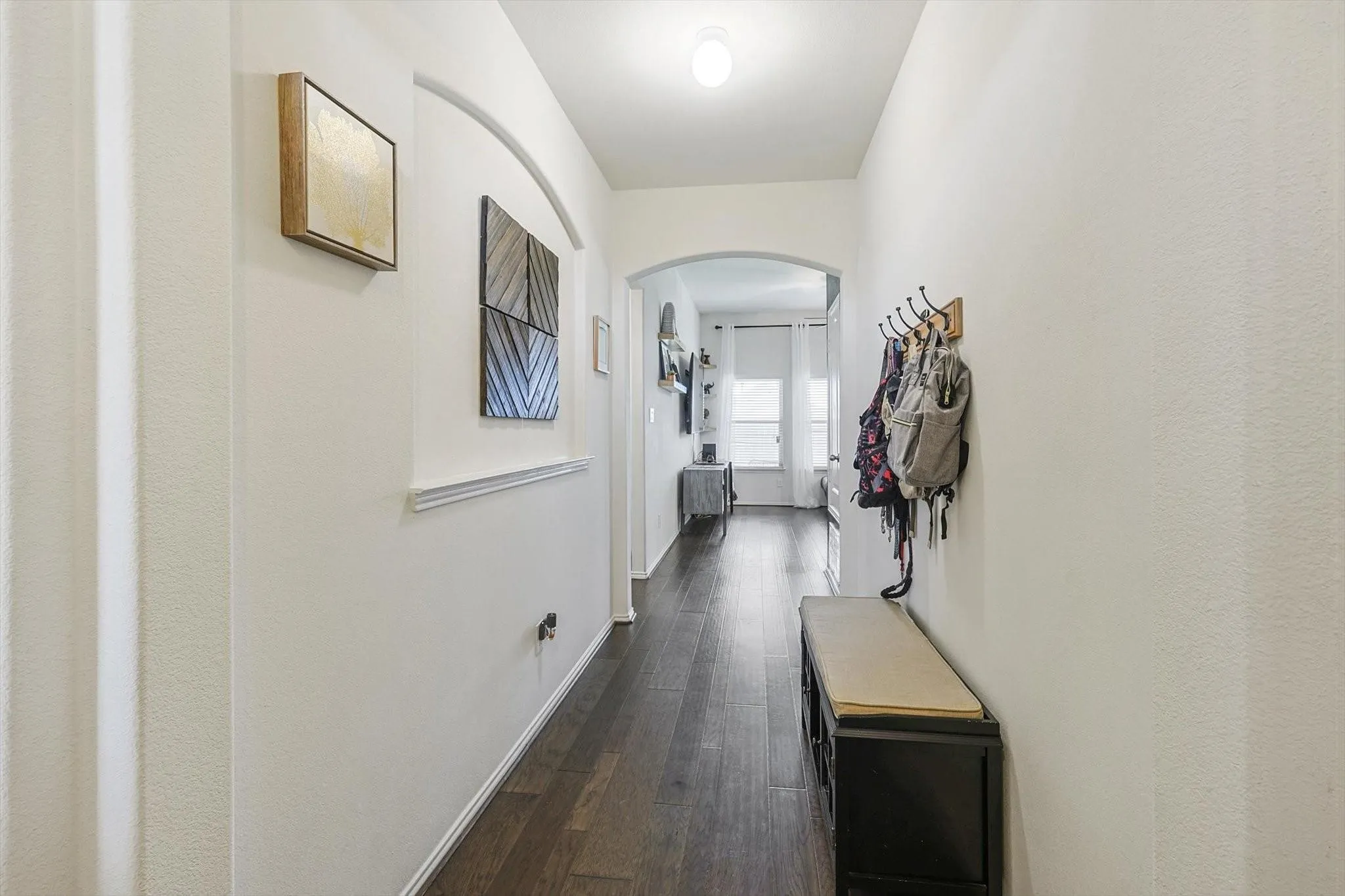 Hallway featuring dark hardwood / wood-style floors