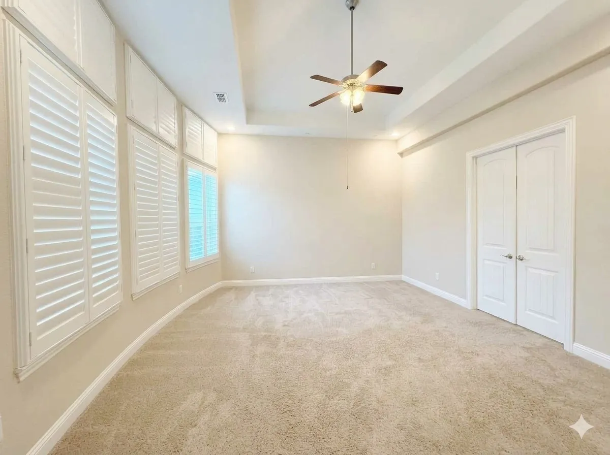 Recessed lighting, ceiling fan, carpeting, tray ceiling, plantation shutters