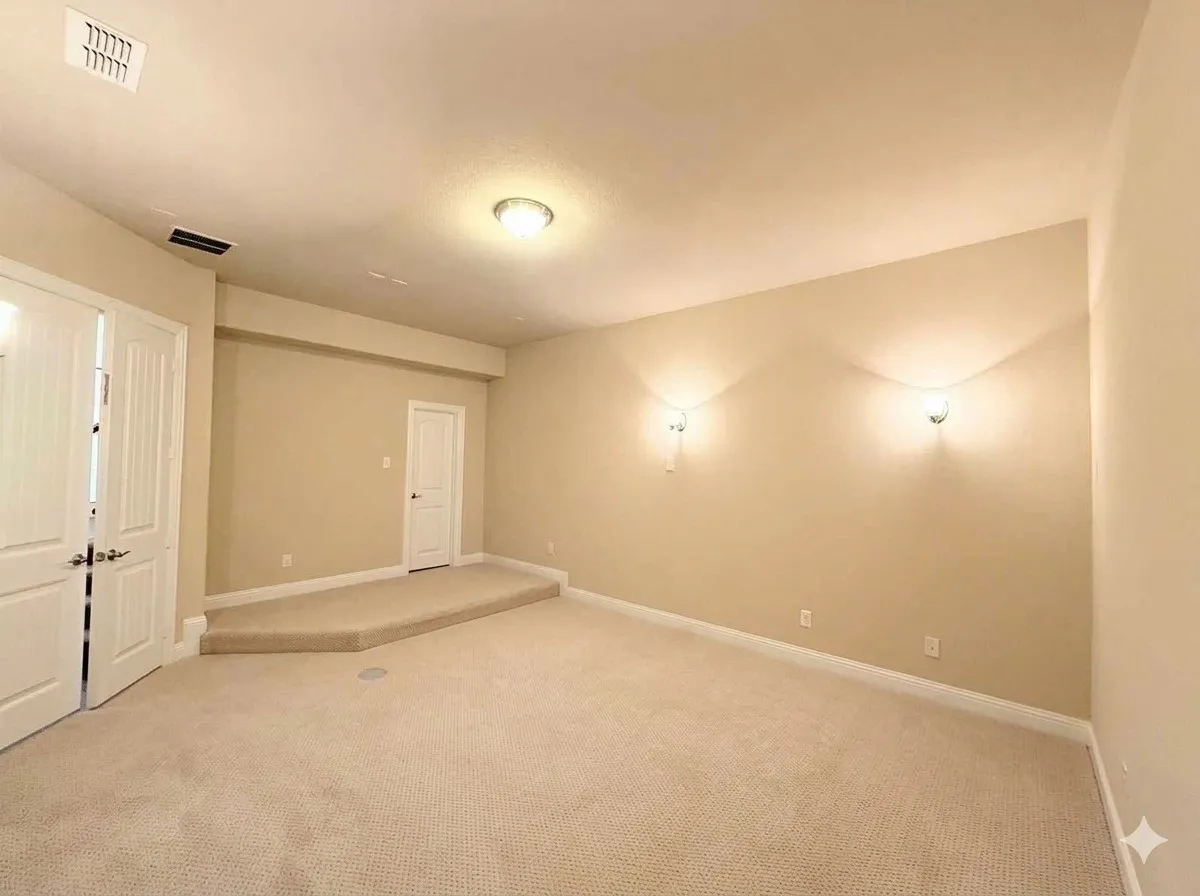 Carpeted room featuring a recessed ceiling light, two wall sconces, a raised platform, and white panel doors