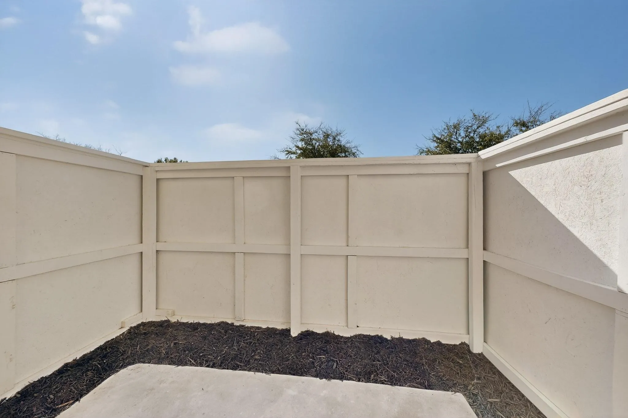 Private outdoor space featuring a concrete patio and perimeter fencing