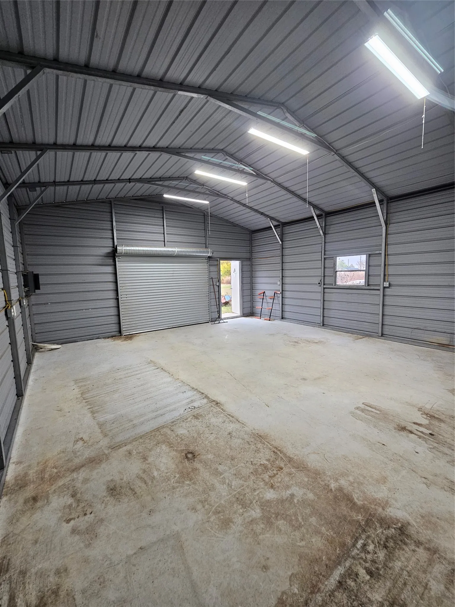 view from the back of 25 by 20 shop with electric and water