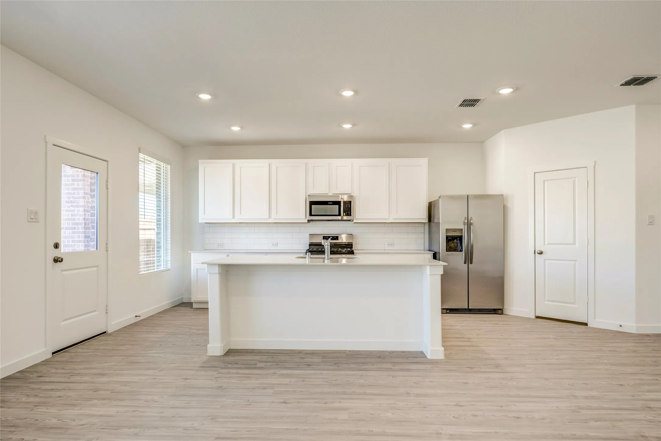 Any cook would LOVE this spacious kitchen with lots of natural lighting and space to move around.....and wait....the pantry..........
