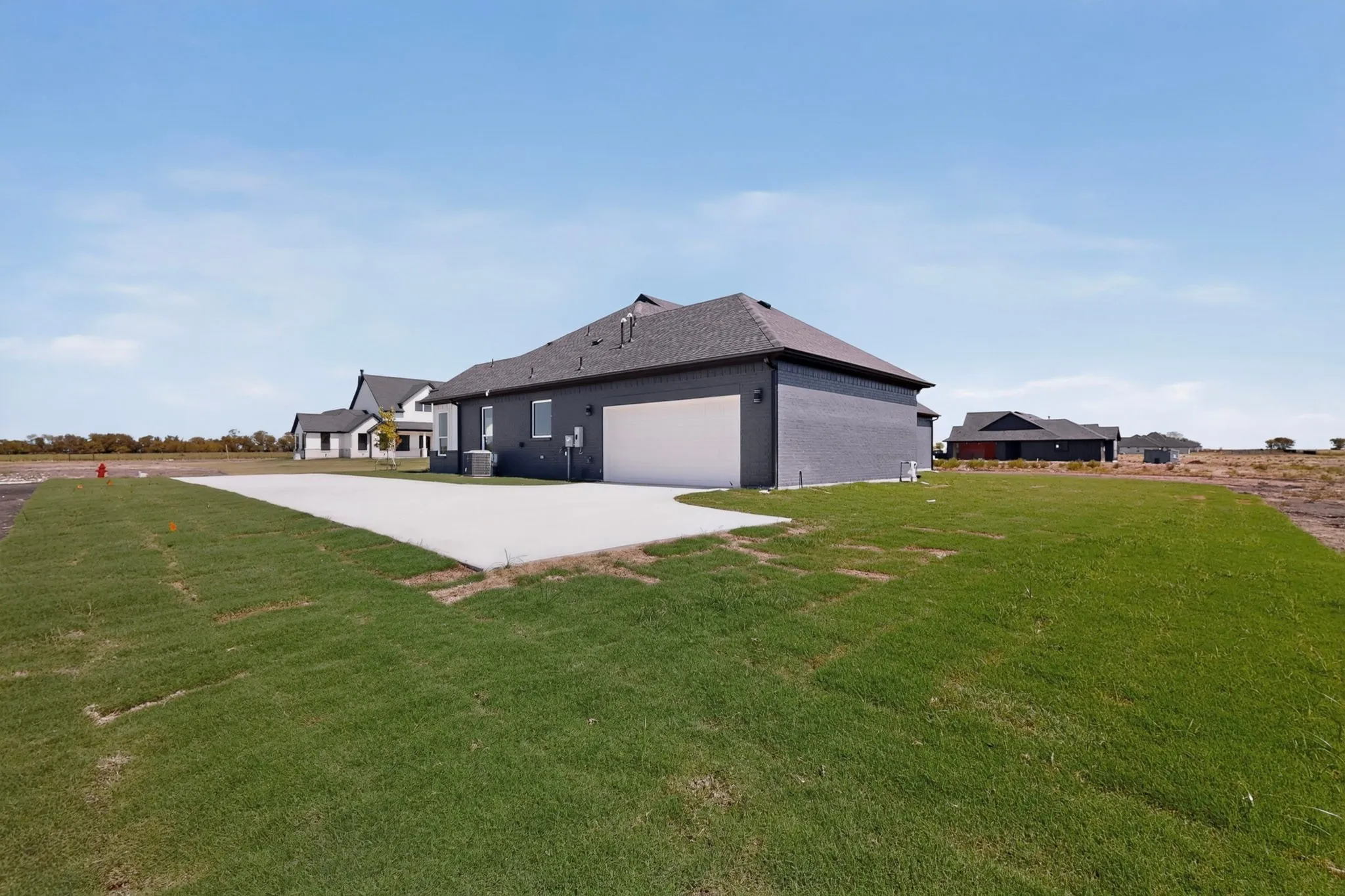 Concrete driveway leading to garage