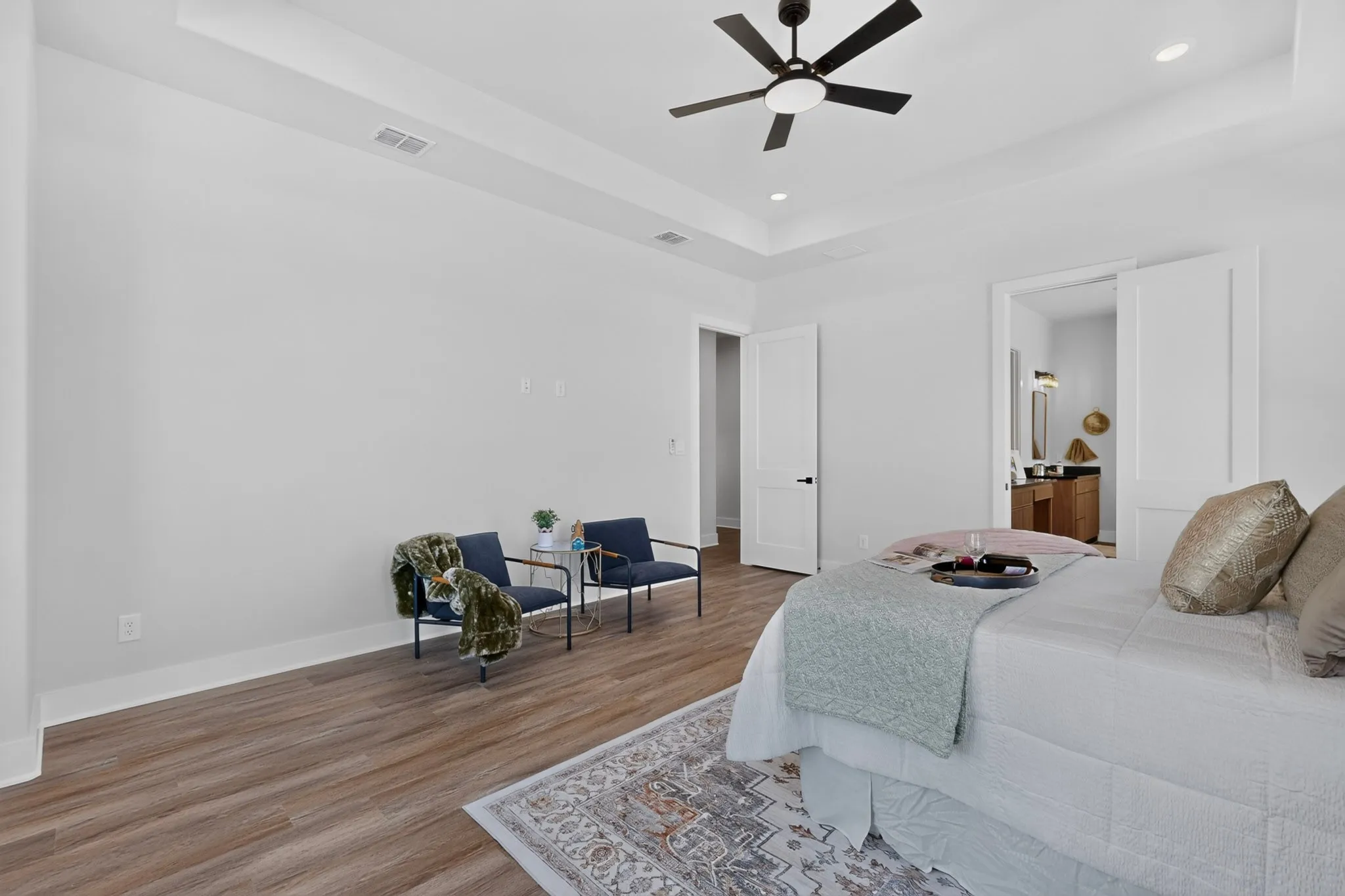 Tray ceiling with recessed lighting, laminate flooring