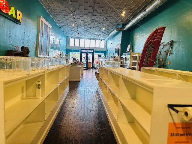 Recessed lighting, wood-finish flooring, exposed ceiling ductwork, storefront windows, and built-in shelving