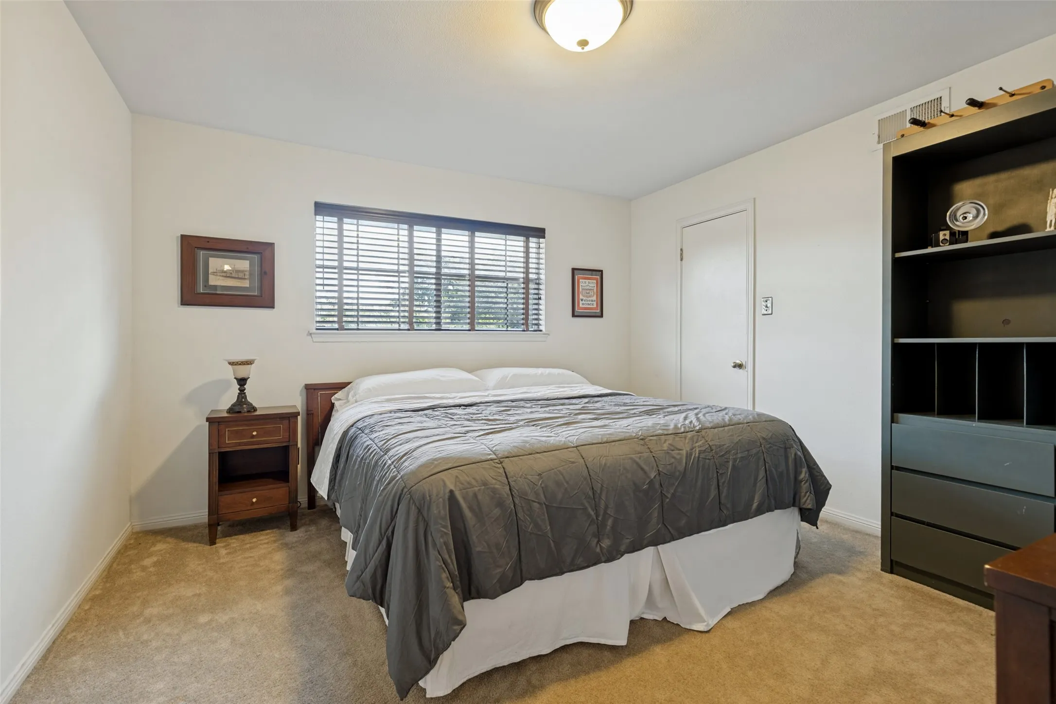 Neutral wall color and carpeted flooring