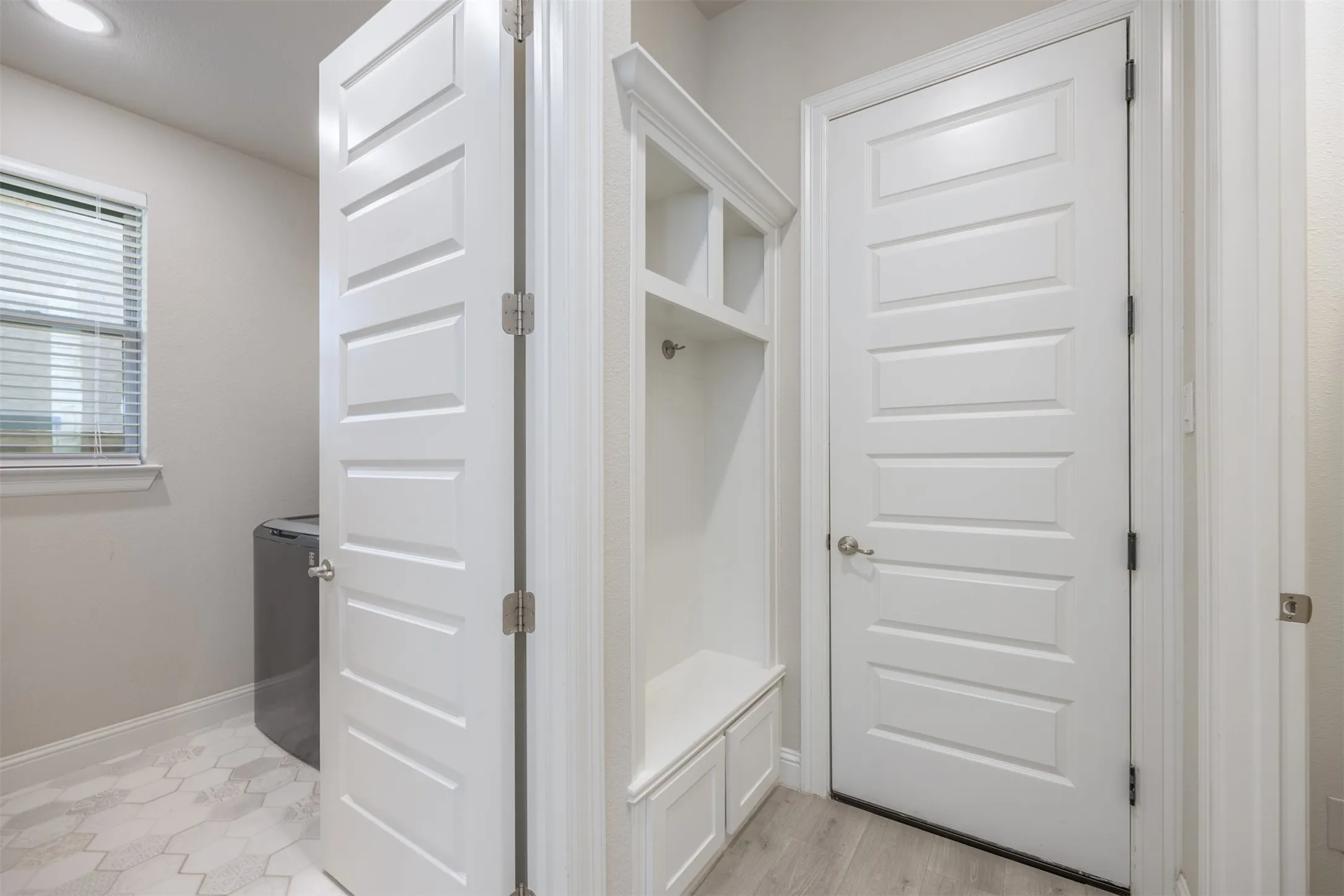 The mud room and laundry room are located at the garage entrance