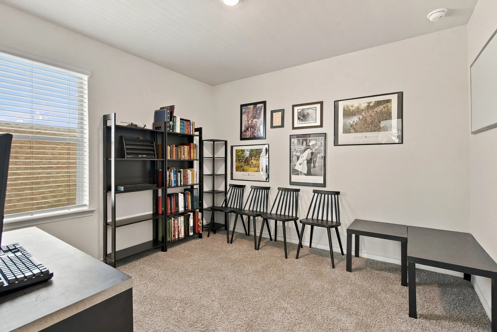 Carpeted room with a window featuring blinds