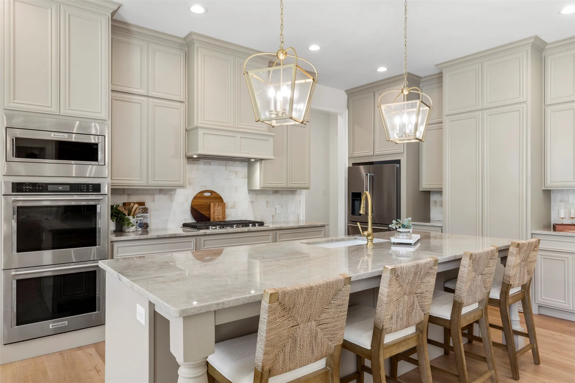 Taj Mahal Quartzite countertops. Double ovens