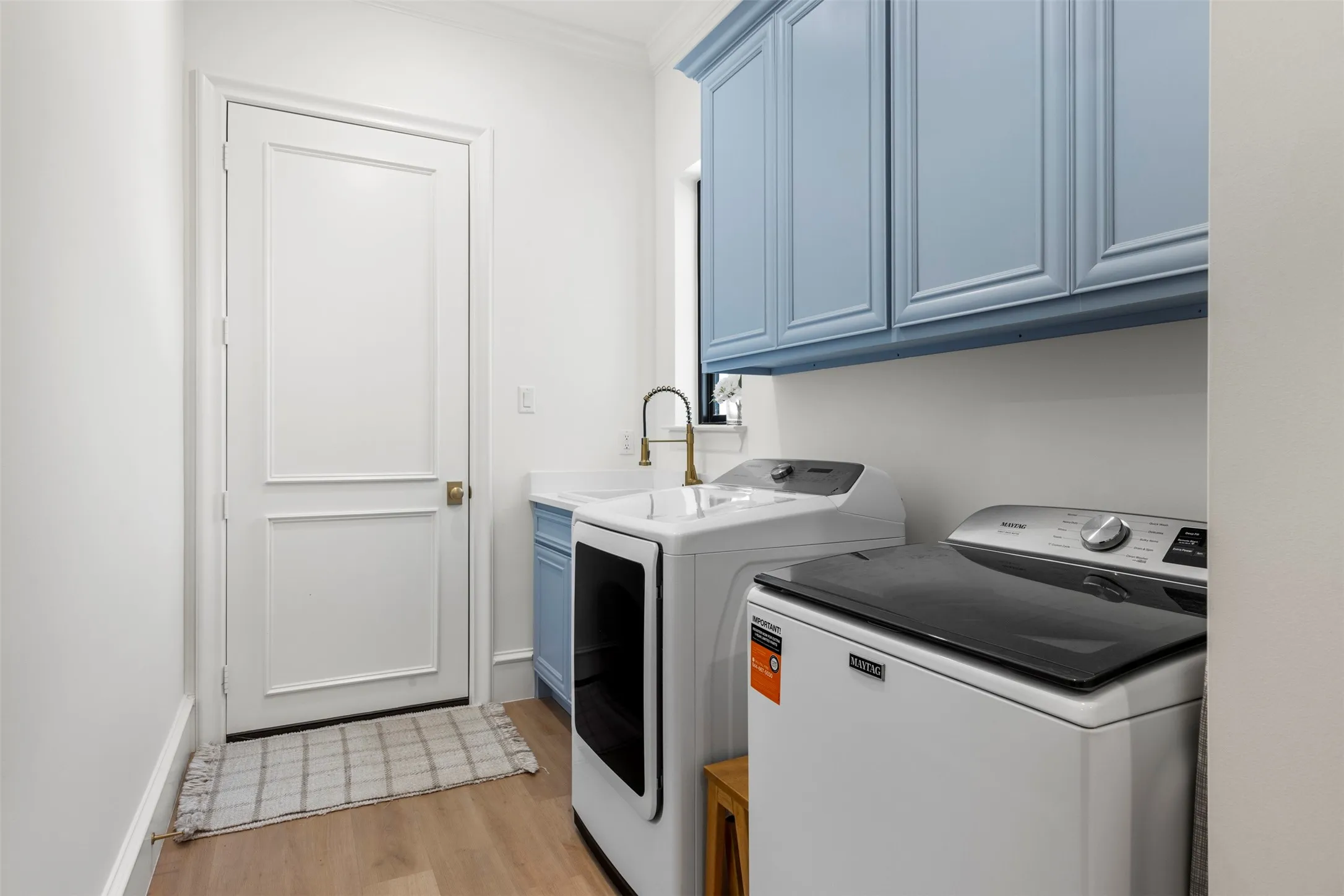 Laundry with ample storage and sink