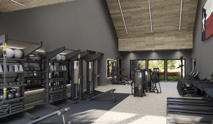 Workout area with high vaulted ceiling