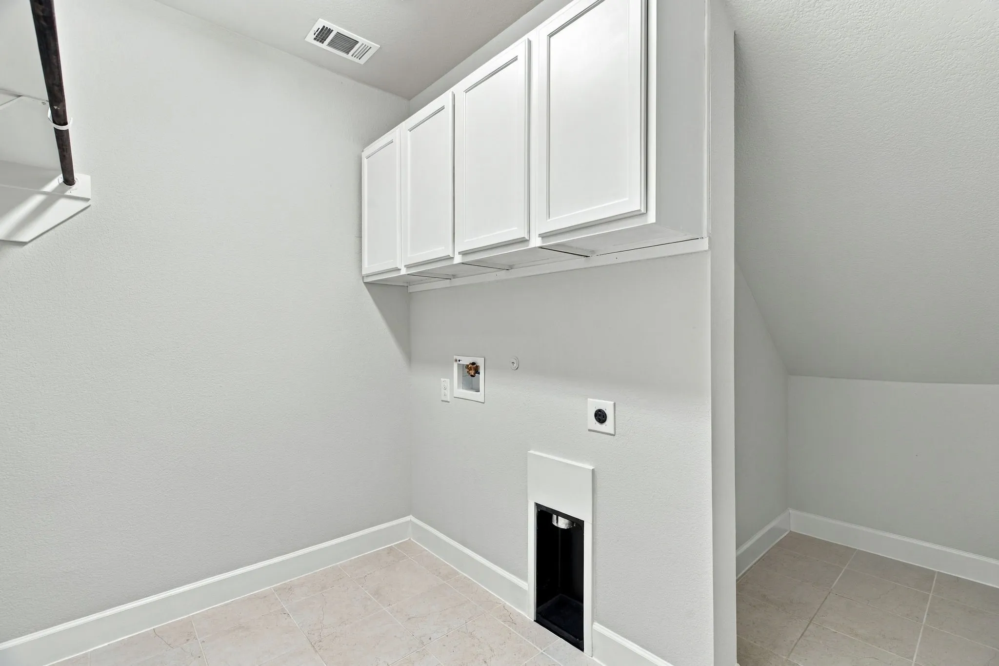 Laundry with spacious under stair storage or tornado safe spot!