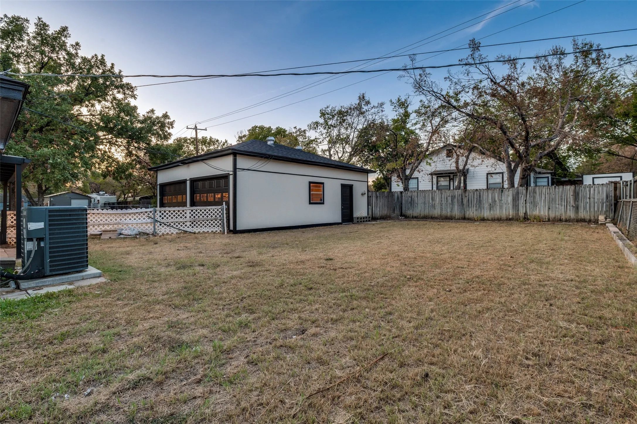 Detached building with two garage doors and a side entry door