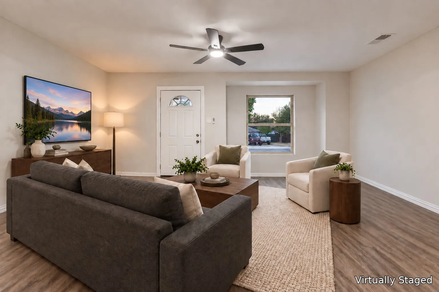 Recessed window, wood-finish flooring, ceiling fan with integrated lighting, paneled entry door with frosted glass insert, and light-toned wall finishes