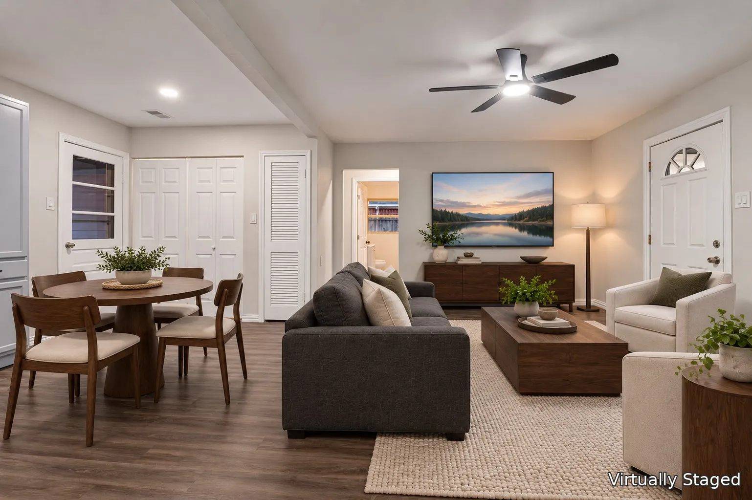 Wood-finish flooring throughout, recessed lighting, a ceiling fan with integrated lighting and a laundry room closet.