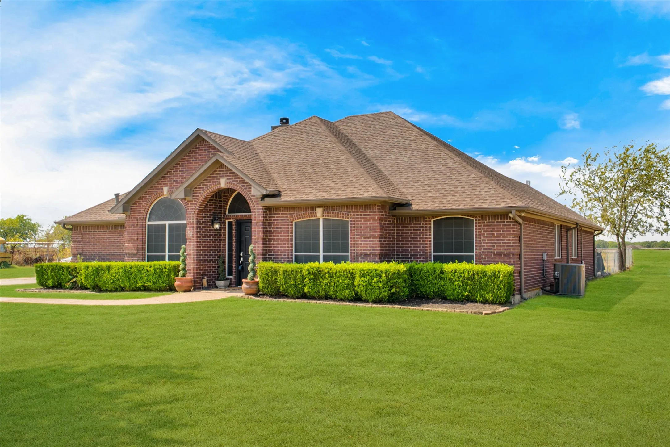 Brick exterior with arched entryway