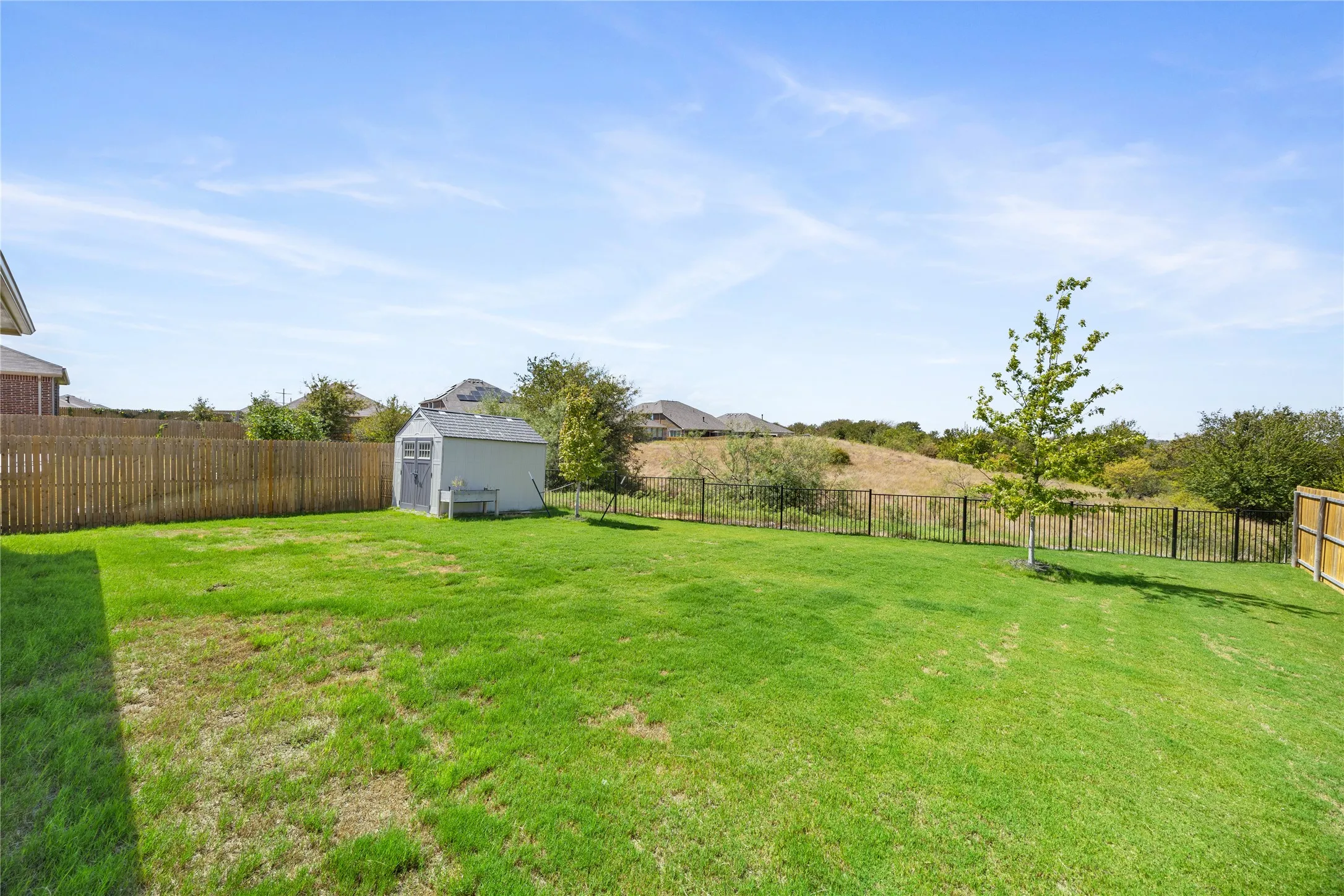 Includes shed for yard equipment, toys,etc.