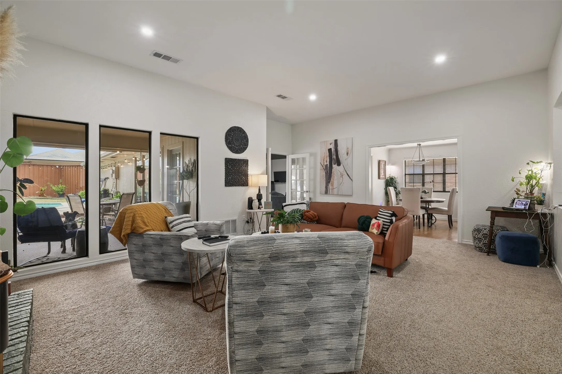 High ceilings, recessed lighting, and three tall windows
