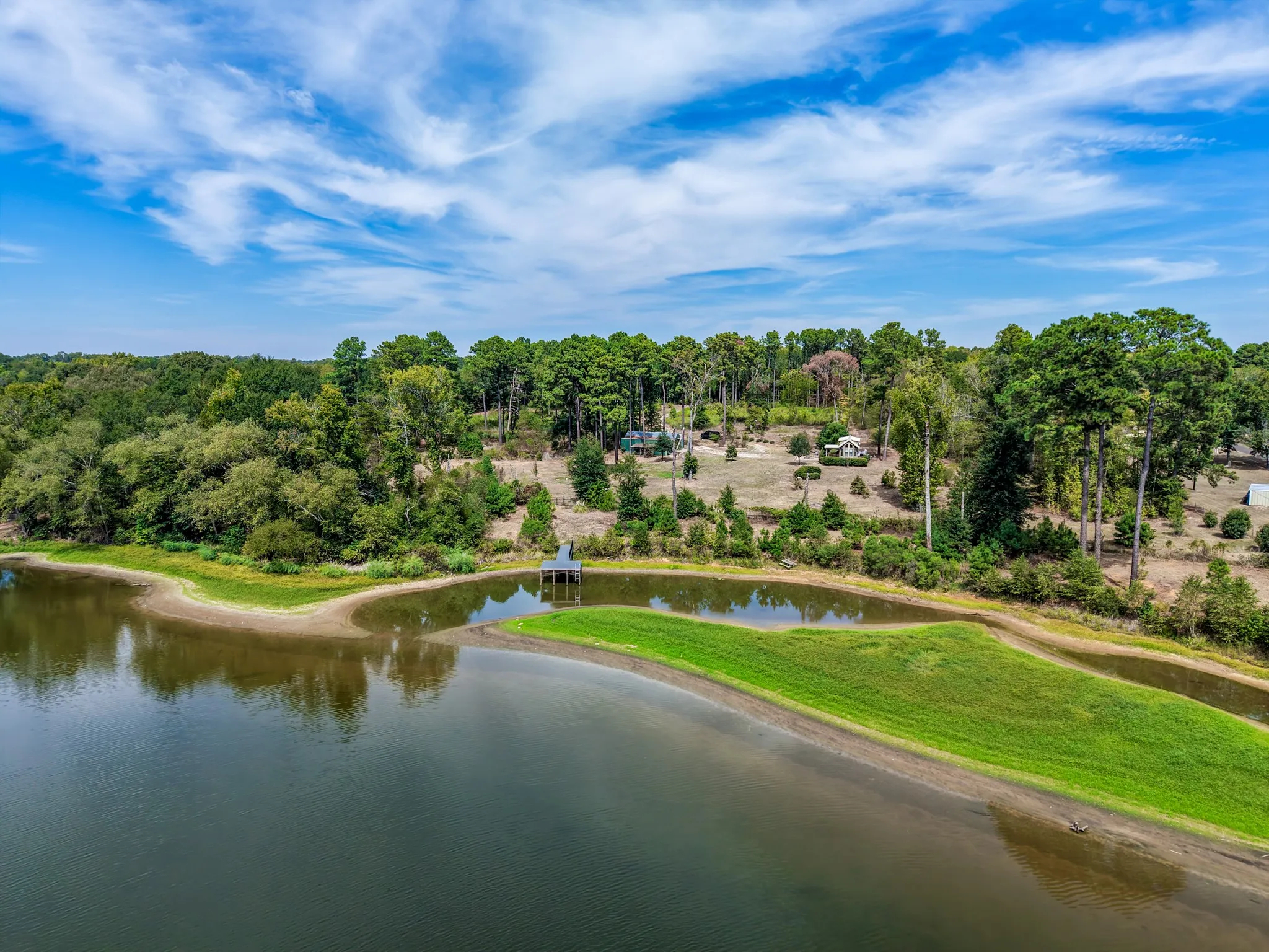 Waterfront view with view of barn and home
