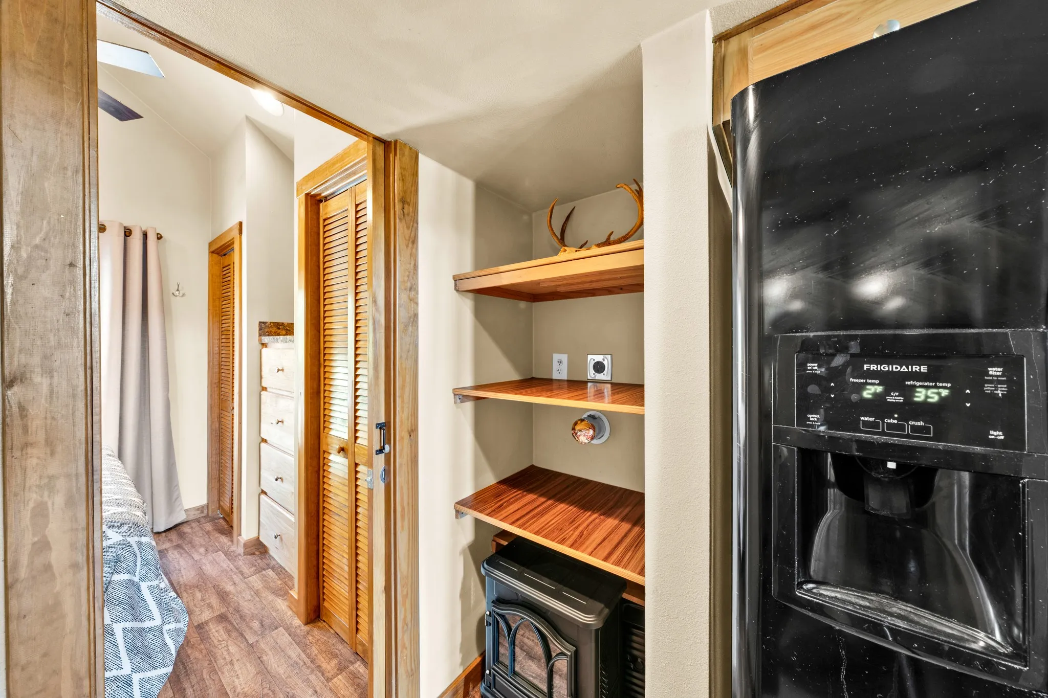 Built-in wooden shelving and heater