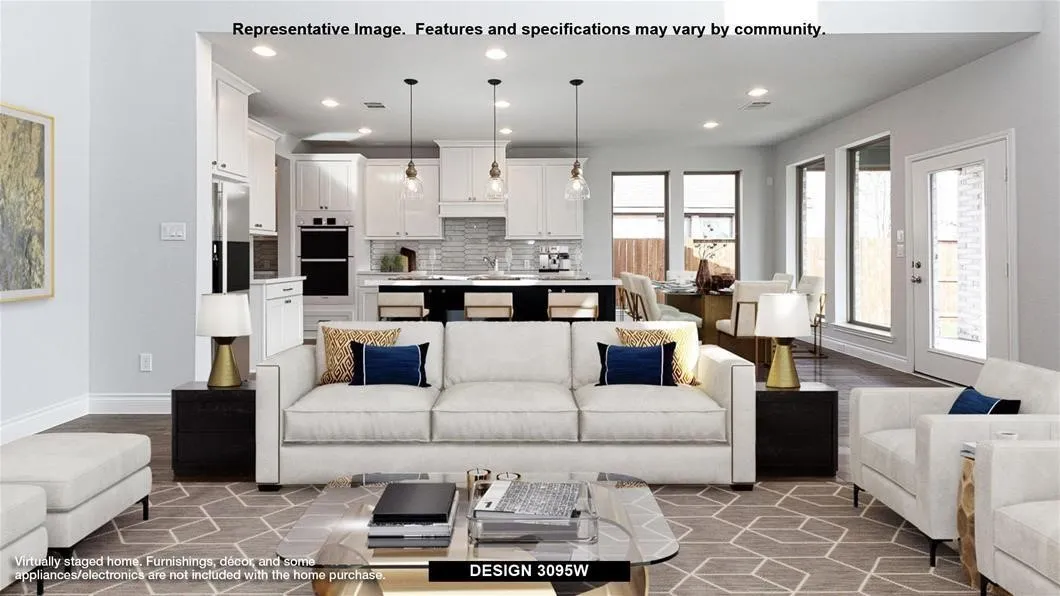White cabinetry, recessed lighting, double wall ovens, clear glass pendant lighting, and an exterior patio door
