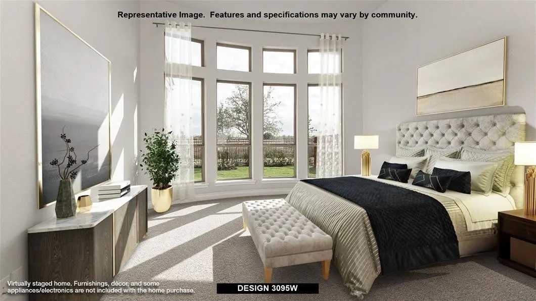 Expansive multi-pane windows, tufted upholstered headboard, built-in lower cabinetry with a light-toned countertop, and light-toned carpet