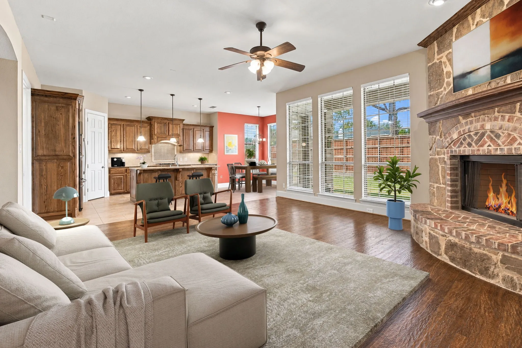 Wood Flooring In Family Room With Gas Burning Fireplace.  This Has Been Virtually Staged.