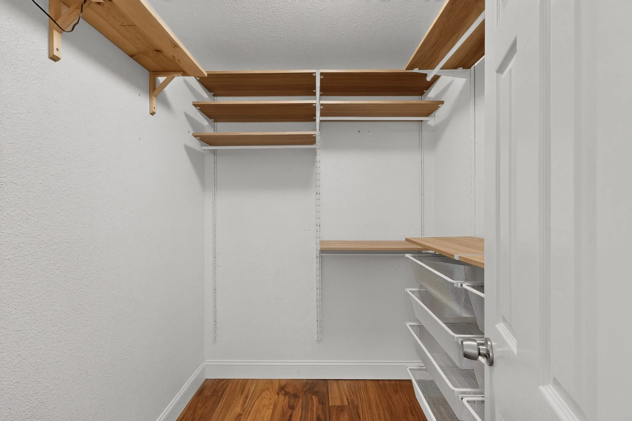 Custom closet in primary bedroom