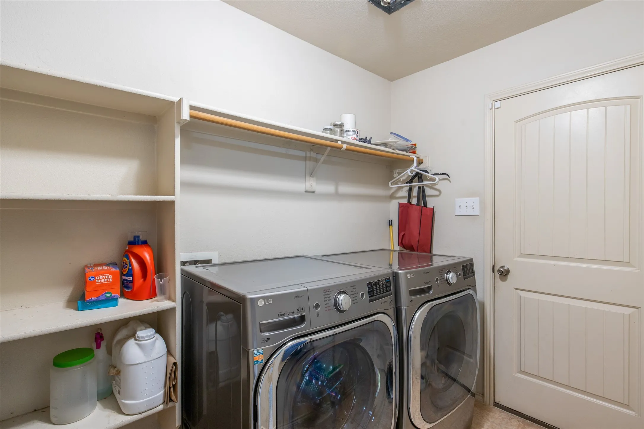 Walk in pantry and utility room with garage entry