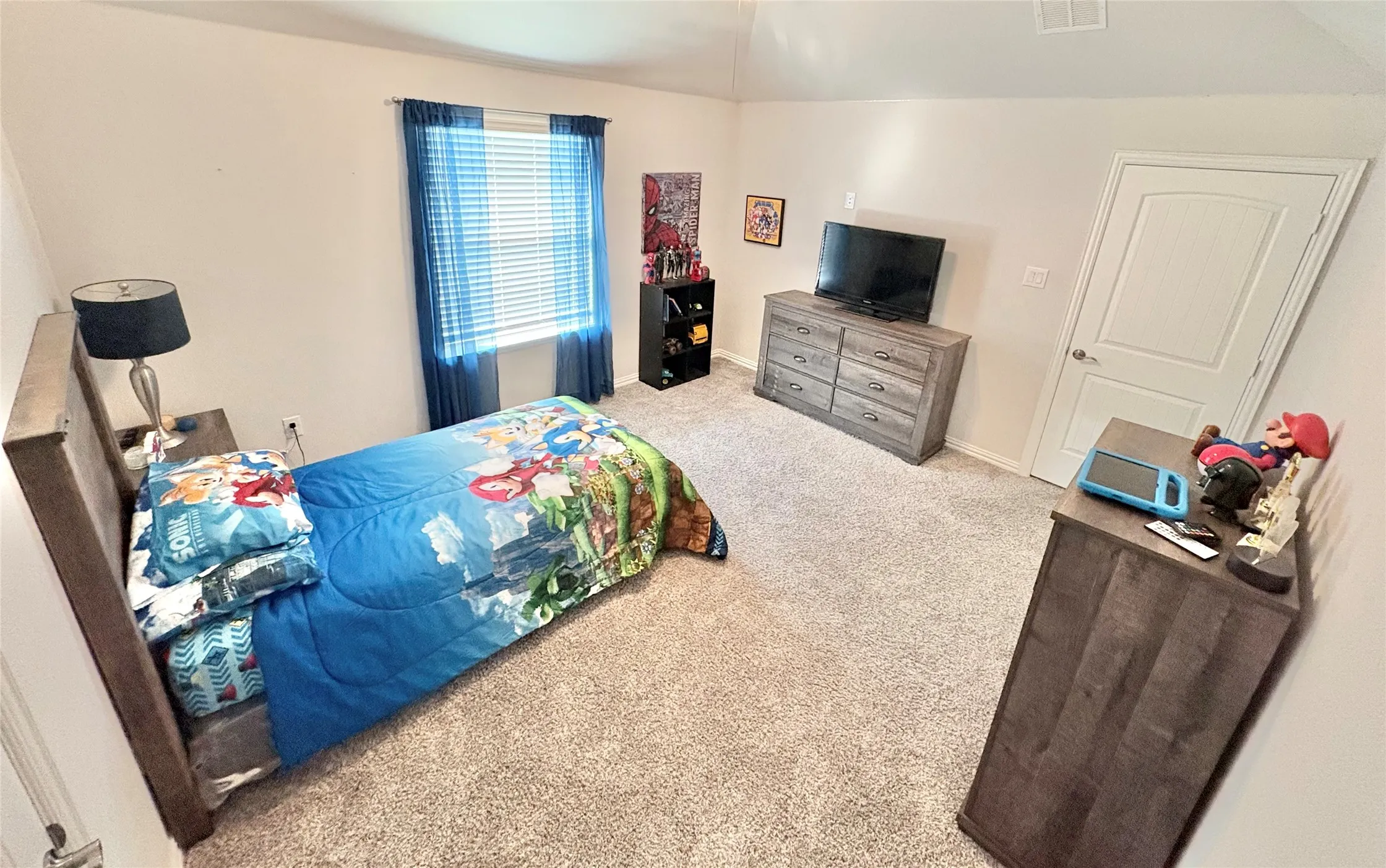 Carpeted flooring, window with blinds, interior door with paneling