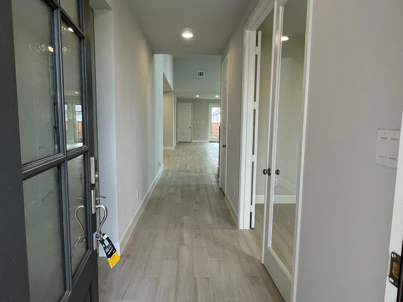 Corridor featuring light hardwood / wood-style flooring