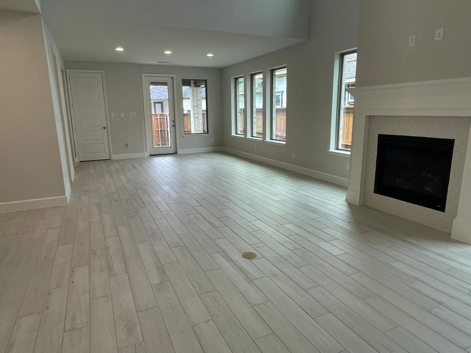 Unfurnished living room with light hardwood / wood-style floors
