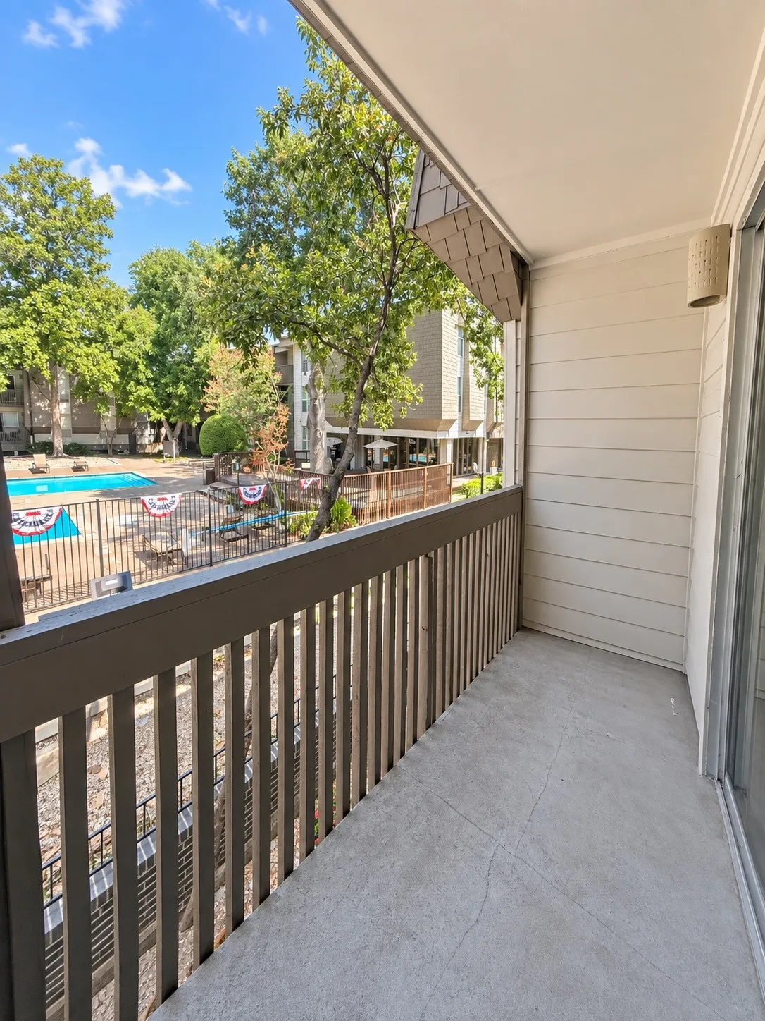 Covered balcony overlooking the pool.