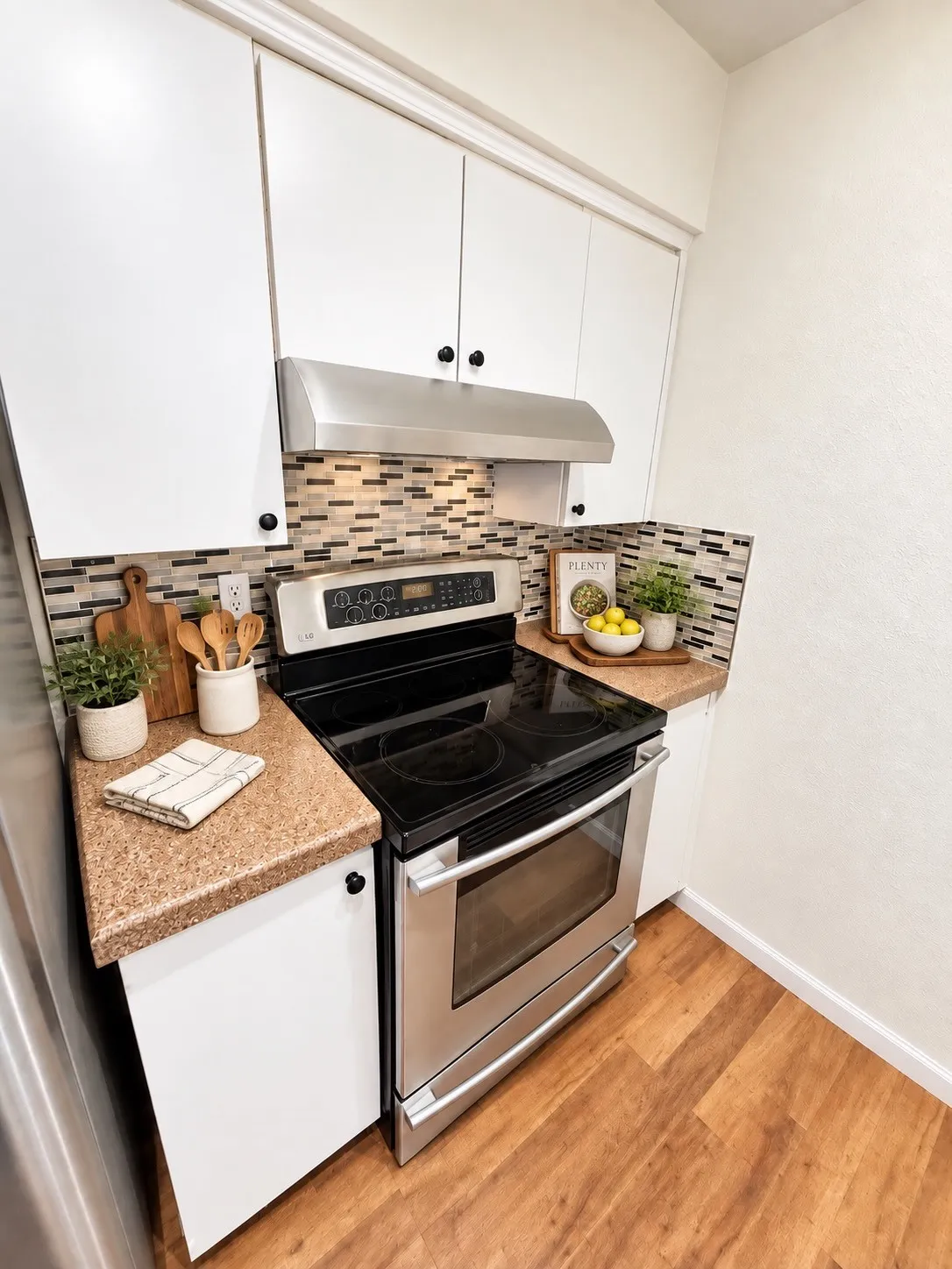 Virtually staged. Range and hood.