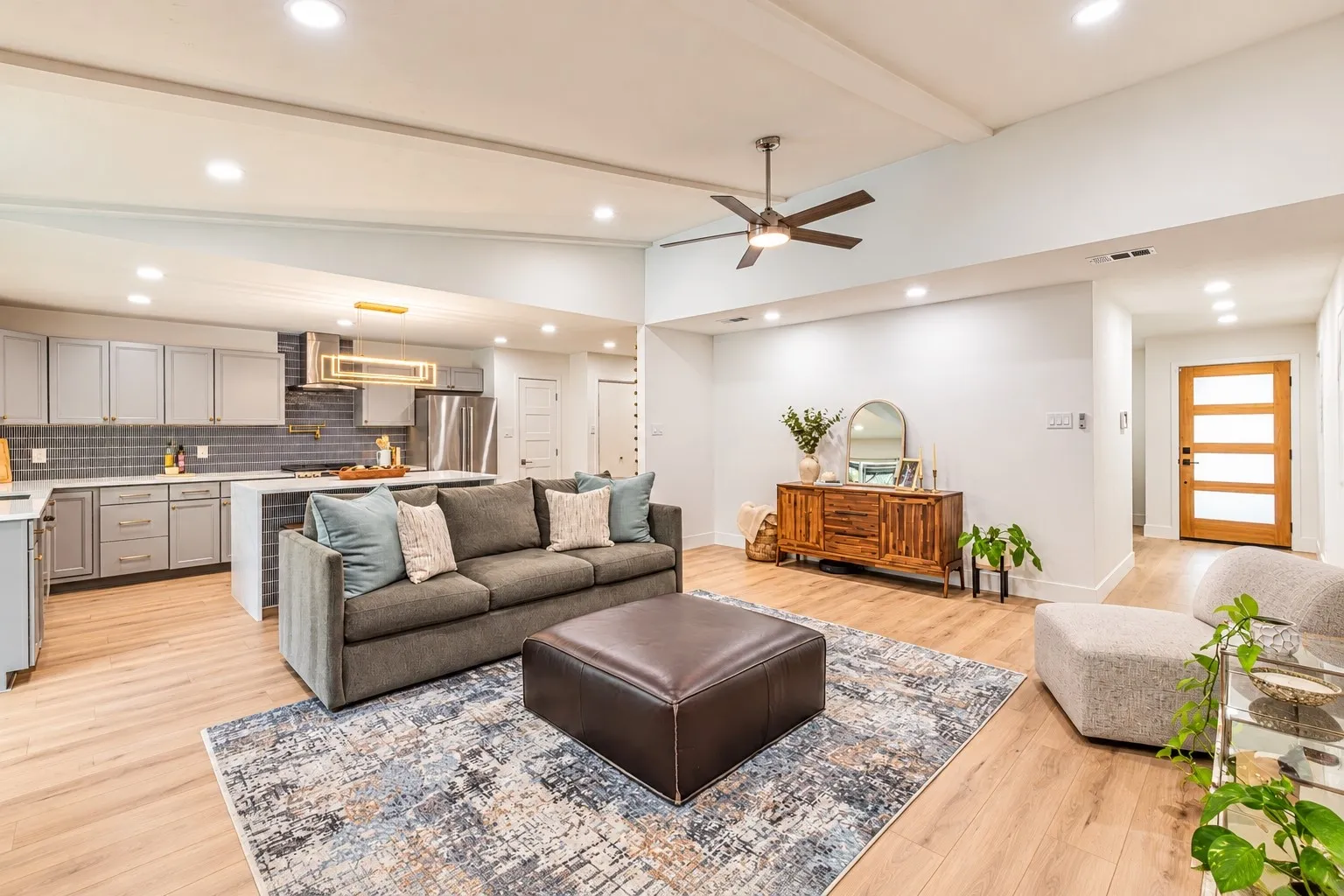 Open-concept living area with wood-finish flooring