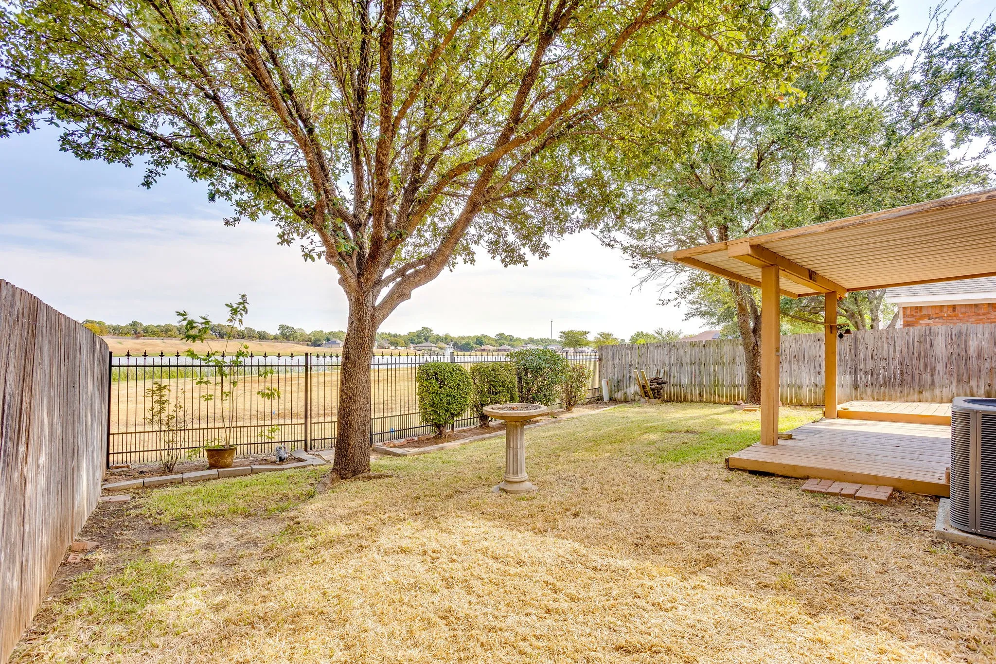 Backyard view!  Privacy fence on both sides and a calming view of the lake from the deck!