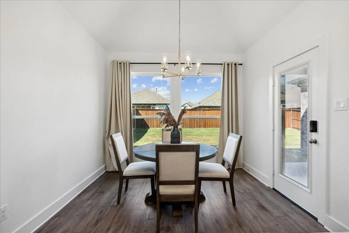 Wood-finish flooring, white walls, and a glass-paneled exterior door