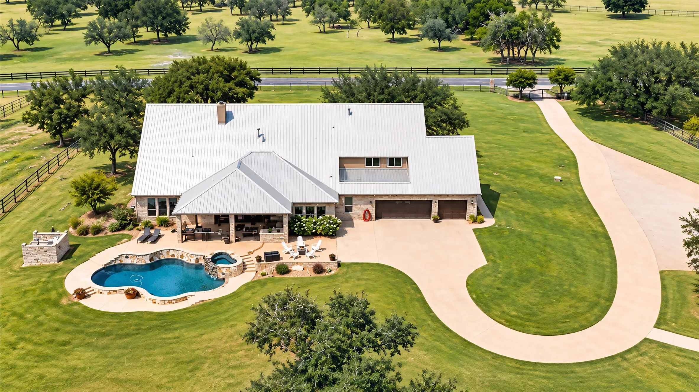 Stone facade with a metal roof, featuring a multi-car garage