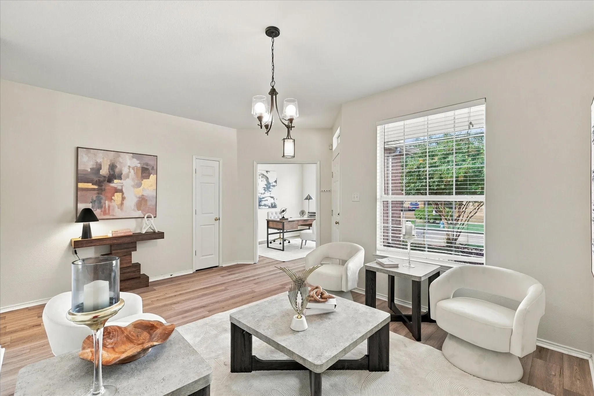 As you enter, a spacious sitting room provides a welcoming place to host friends and family. The versatile space could also easily serve as a playroom, formal dining room or whatever best fits your lifestyle.