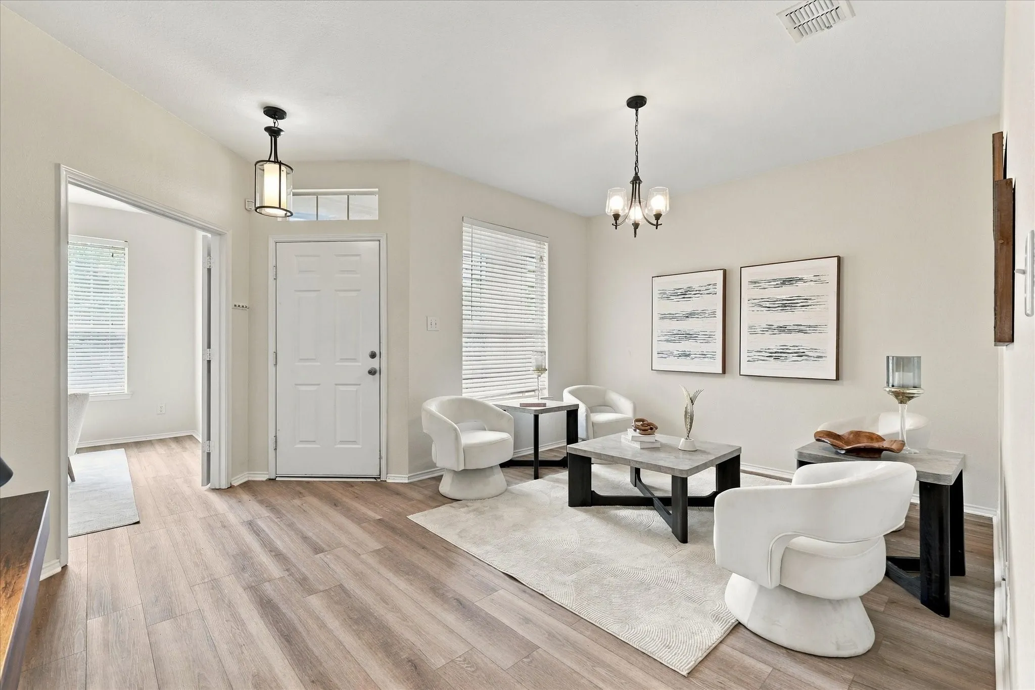 Upon entering, you'll find a light and bright sitting or dining room, along with French doors leading to the dedicated office. The open floorplan creates an easy, welcoming flow throughout the main living spaces.