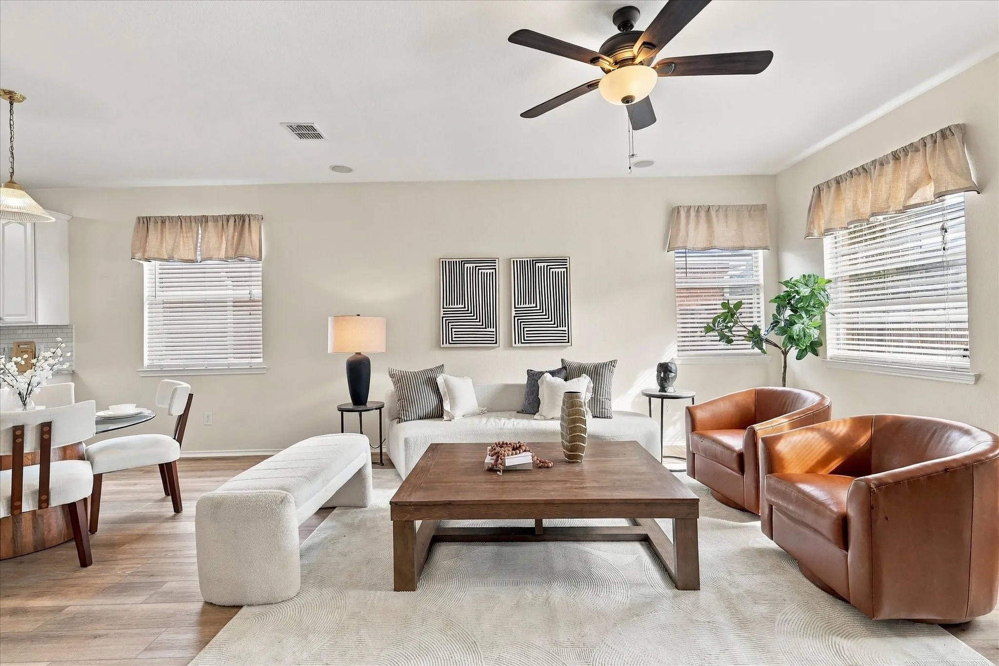 Windows throughout the home fill the spaces with natural light, creating a sunny and cheerful atmosphere.