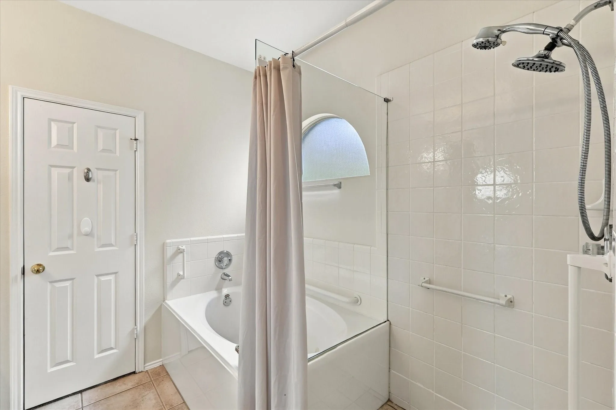 The primary bathroom offers the best of both worlds with a walk-in shower for everyday convenience and a jetted tub for relaxing at the end of the day.