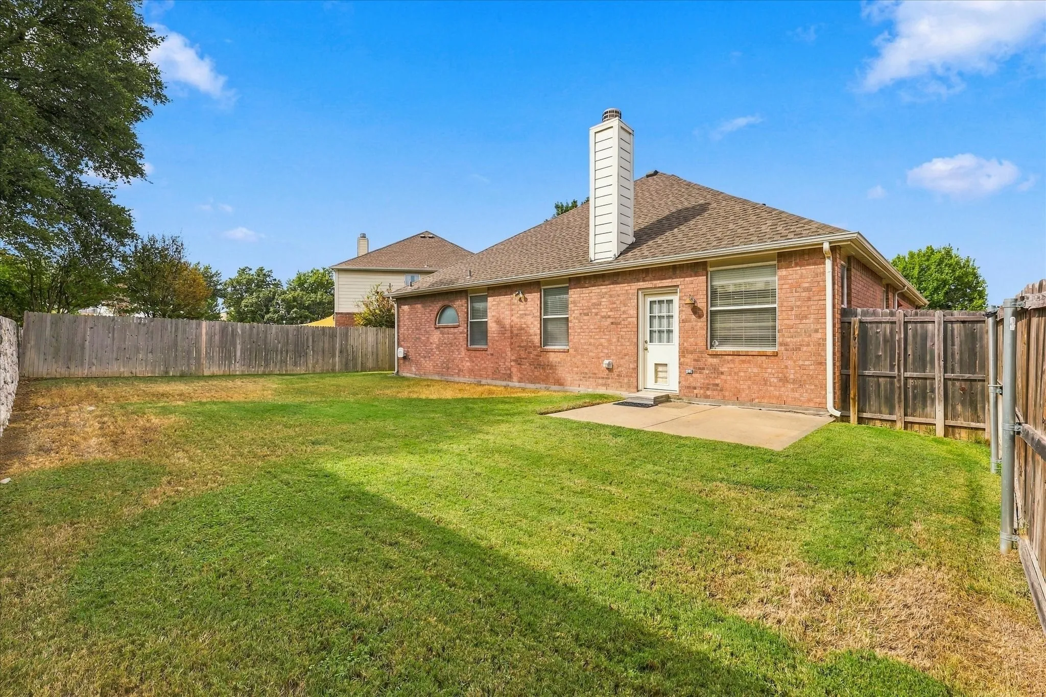 A spacious backyard offers plenty of room to play, entertain, garden or create the outdoor space you've always wanted.