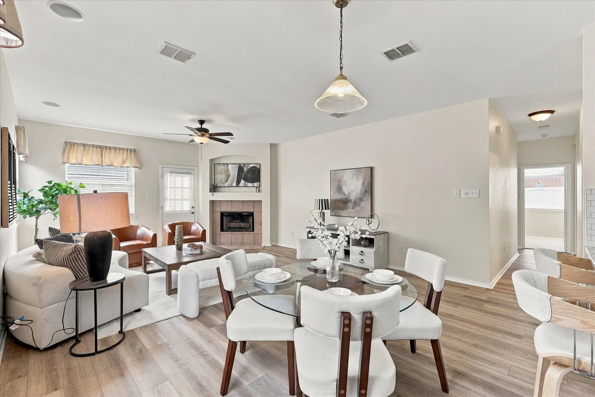 The kitchen opens to a breakfast room with additional seating and flows seamlessly into the living room, creating an open layout that keeps everyone connected. Whether you're making dinner, enjoying a casual meal or entertaining friends, everyone can be part of the conversation.