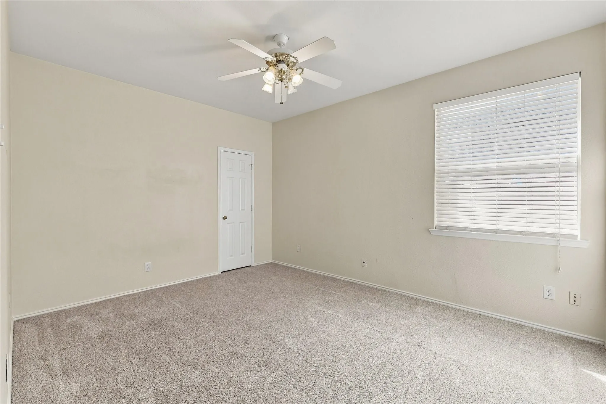 Shown here without staging, this spacious secondary bedroom gives you a true sense of the room’s size, space and flexibility.